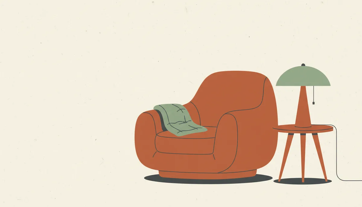 Illustration of a cozy armchair with a folded blanket and reading lamp